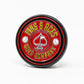The Pop Out Medallion Ball Marker - Red by Pins and Aces features a round, red design with a white spade and "Pins and Aces" text, bordered by golf balls on a white background.