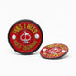The Pop Out Medallion Ball Marker - Red by Pins and Aces features “PINS AND ACES” in yellow around a spade and two golf balls; one magnetic marker stands upright while the other lies flat.