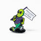 Show off your style with the Pins and Aces HEYDUDE – Alien Ball Marker: a vibrant enamel pin of a smiling green alien in a purple shirt, green sandals, and holding a PINS & ACES X HEY DUDE sign.