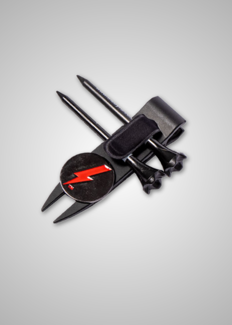 THE BYRD GOLF DIVOT CLYP by The Byrd, LLC: Includes a black divot tool with a red lightning bolt marker, two tees, and two ball markers held by a sleek strap—shown on a grey background. Low stock—get yours today!.