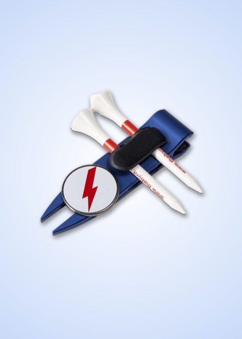 The Byrd GOLF DIVOT CLYP by The Byrd, LLC organizes your gear—a blue pouch holds two white golf tees with red stripes, a red lightning bolt marker, and a metal divot tool. HOT PRODUCT—grab yours before they're gone!.
