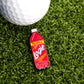 A 24-ounce red Logie Joe's Golf Redpop Ball Marker, inspired by classic soda, sits on artificial grass beside a white golf ball—ideal as a fun and unique golf accessory.