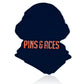 The Rockin Washington - Ball Marker by Pins and Aces is a dark, silhouette-shaped golf accessory featuring bold orange branding. It functions as both a magnetic hat clip and ball marker, shown on a white background.
