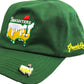 The Smashters Ball Marker by Grunk Dolfer is a green cap with an embroidered beer logo, red flag, and "SMASHTERS." "Gronkd" is stitched on the side, and it features a magnetic golf ball marker—ideal for unique golf gifts.