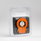 The Pins and Aces South Park Ball Marker - Kenny is displayed in orange hoodie packaging with large eyes and a covered face, on a black backing card in a clear plastic case against a plain white background.