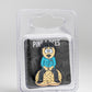 The South Park Ball Marker - Randy by Pins and Aces features a cartoon enamel pin of Randy with disheveled hair, wide eyes, and open mouth on a sand mound—perfect for any Pins and Aces or South Park golf collection.