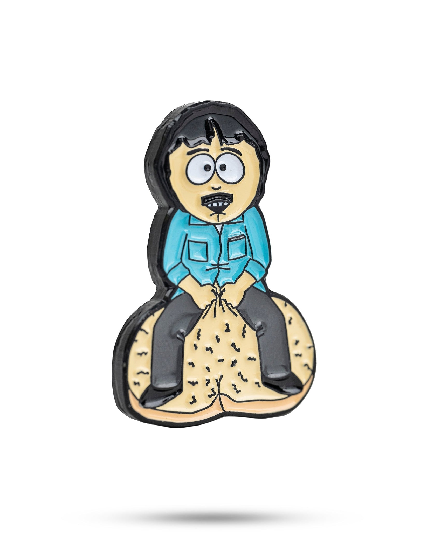 The South Park Ball Marker - Randy by Pins and Aces is a cartoon-style pin showing Randy with black hair and a mustache, sitting on two large golf balls—ideal for fans of premium ball markers.