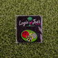 The Logie Joe's Golf Stinger pin set features a bee with a golf club on artificial grass with red, green, and yellow accents. Perfect as premium accessories or unique ball markers for golfers.