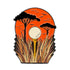A golf ball on a tee stands in tall grass, framed by trees and an orange sunset sky with flying birds—a perfect scene, captured by the Sunset Tee Time Ball Marker from Ballmarkers.com.