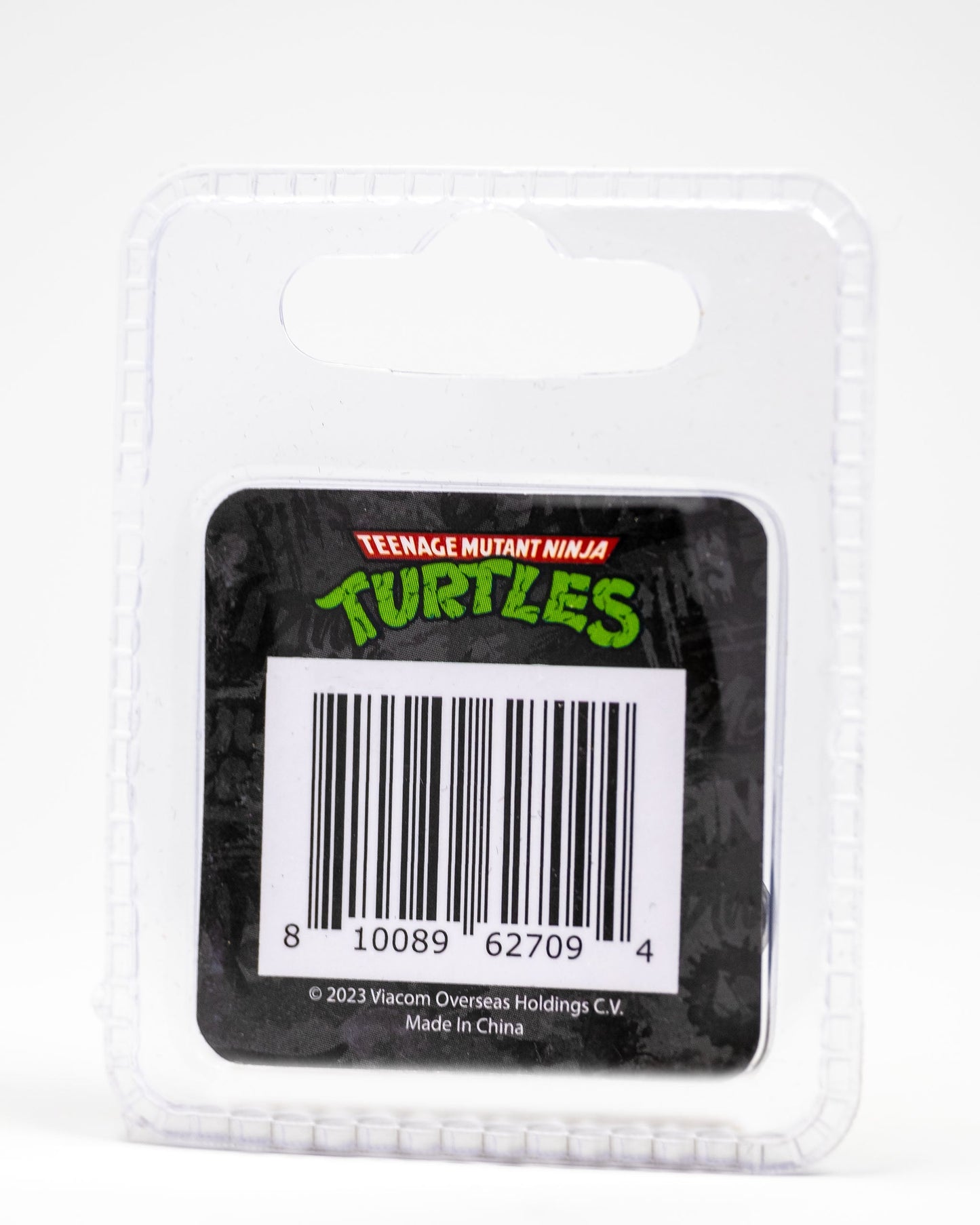 Clear plastic packaging with a black card insert featuring the TMNT logo, barcode, and "Made in China by Viacom Overseas Holdings." Includes a Pins and Aces exclusive TMNT - Donatello Ball Marker—ideal for Teenage Mutant Ninja Turtles golf fans.