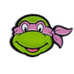 Show off your TMNT fandom with the Pins and Aces TMNT - Donatello Ball Marker—a smiling green turtle head with a pink mask and bandana on a white background, perfect for adding fun to your golf game.