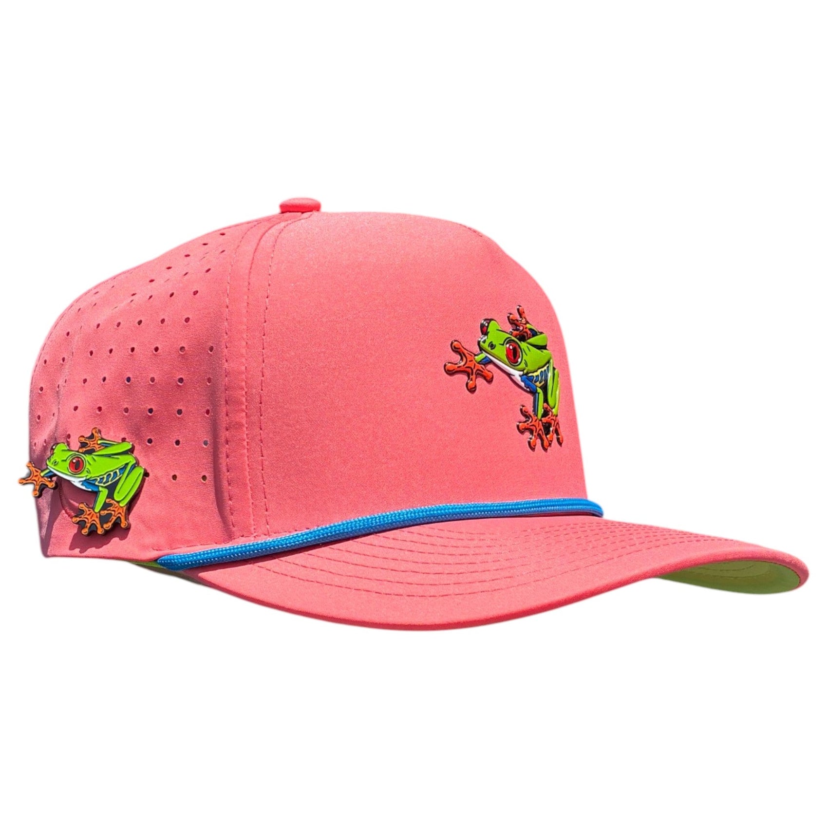 The Tree Frog Golf Hat by Logie Joe's Golf is a snapback cap with blue piping, green and red frog designs, ventilation holes, and an adjustable fit. It features a built-in magnetic ball marker holder with marker included.