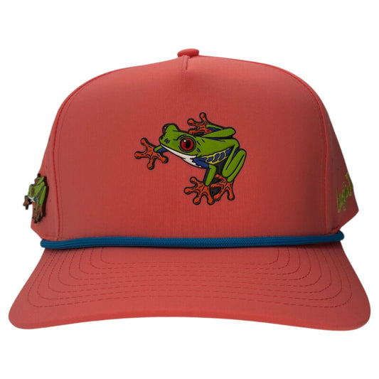 The Logie Joe's Golf Tree Frog Golf Hat is a coral snapback cap with blue trim, colorful frog graphics, side details, and features a built-in magnetic ball marker holder with marker included. Adjustable fit. Red Eyed design.