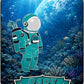 A cartoon astronaut in a teal suit stands underwater among coral and fish, holding an Astronaut Walker Mystery Blind Bag by Ballmarkers.com. The website ballmarkers.com is featured at the top, with "RARE 1 OF 50" displayed at the bottom. Above the water, Earth can be seen, making this golf ball marker from Ballmarkers.com truly out of this world.