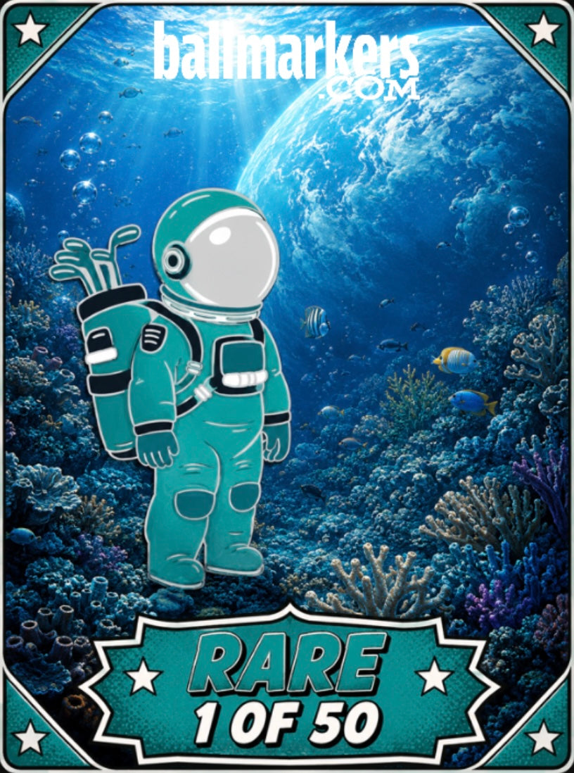 A cartoon astronaut in a teal suit stands underwater among coral and fish, holding an Astronaut Walker Mystery Blind Bag by Ballmarkers.com. The website ballmarkers.com is featured at the top, with "RARE 1 OF 50" displayed at the bottom. Above the water, Earth can be seen, making this golf ball marker from Ballmarkers.com truly out of this world.