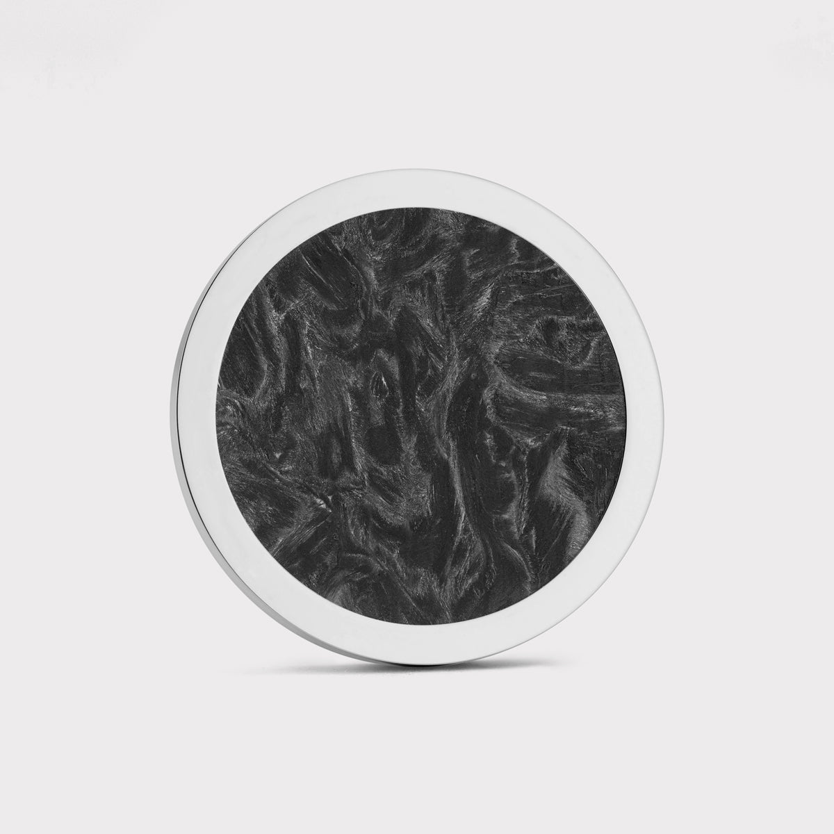 The Venom by Doubloon is a round object featuring a white rim and a textured black marbled forged Carbon Fiber center, displayed against a plain white background.