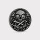 The Omen Classic Antique, Diamond & Silver Edition by Doubloon is a round, metallic golf marker with a lab-grown diamond skull, crossed bones, intricate edge detail, and “MARKS THE SPOT” engraved at the bottom.