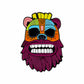 The Tiki Bear Ball Marker by Logie Joe's Golf features a bold, stylized bear face with vibrant orange, blue, yellow, and purple patterns—making it the perfect unique golf accessory for your collection.