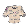 The Titties & Tattoos Ball Marker by Logie Joe's Golf is an illustrated, topless tattooed torso pin with "Titties And TATTOOS" across the chest— a bold, funny golf ball marker and unique accessory for your game.