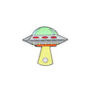 The Logie Joe’s Golf UFO Ball Marker features a cartoonish UFO with a green dome, red lights, and a yellow beam—simple, colorful, and outlined in black to add fun style to your game.