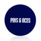 A dark blue circular "USA Soccer Ball - Ball Marker" by Pins and Aces, featuring an enamel finish and "PINS AND ACES" in bold white letters at the center.