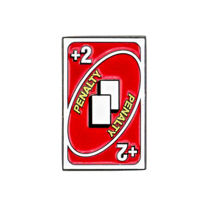 Logie Joe's Golf 2 Penalty Card Ball Marker: A red marker with a bold “+2” in each corner, “PENALTY” diagonally repeated, and two white overlapping rectangles—ideal for marking a two-stroke penalty on the golf course.