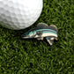 A close-up of a golf ball on artificial grass beside Logie Joe's Golf "Walleye" pin—a blue, green, and white fish-shaped enamel marker for anyone who loves funny golf accessories.