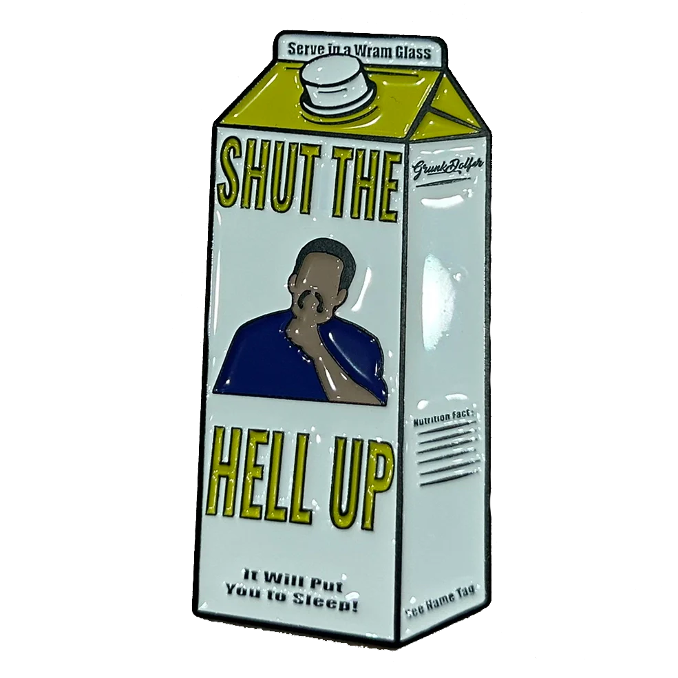 The Grunk Dolfer Warm Glass Ball Marker is shaped like a milk carton, with “Shut The Hell Up” in bold yellow, an illustration of someone shushing, and “It will put you to sleep!” in smaller text.