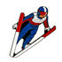 The Ski Jumping Ball Marker by Ballmarkers.com features a Team USA ski jumper in mid-air, dressed in a blue, red, and white suit with helmet and goggles, skis forming a V-shape against a crisp white background.