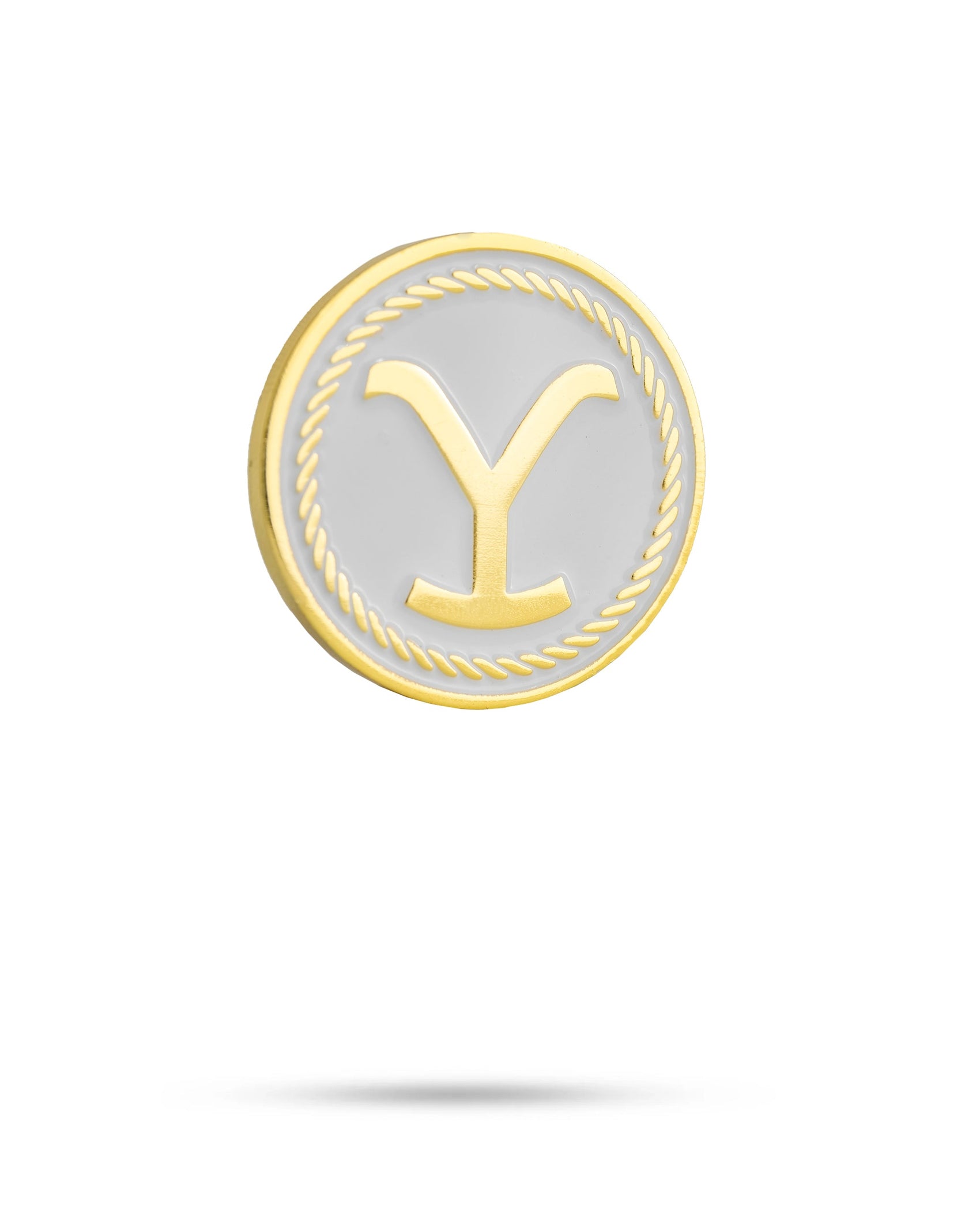 The Yellowstone Ball Marker by Pins and Aces features a round, gold-bordered design with a rope pattern, white background, and bold gold Y. Part of the exclusive Yellowstone ball markers golf accessories collection.