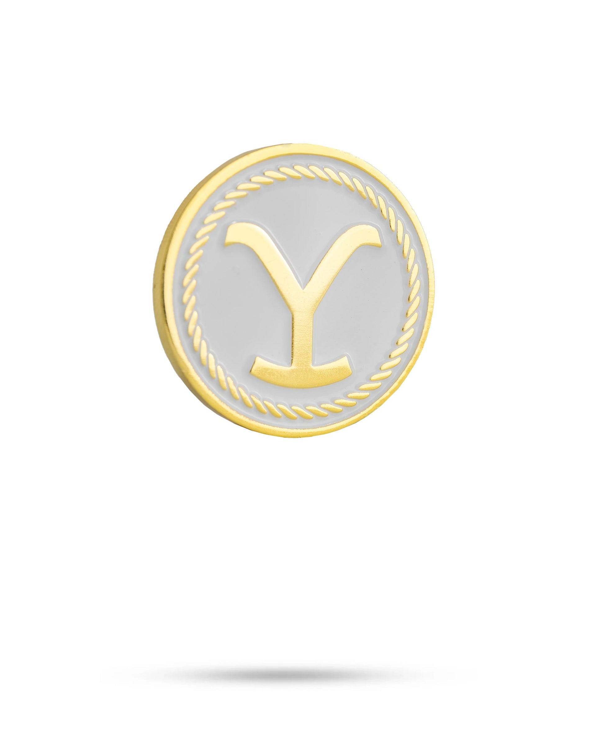 The Yellowstone Ball Marker by Pins and Aces features a round, gold-bordered design with a rope pattern, white background, and bold gold Y. Part of the exclusive Yellowstone ball markers golf accessories collection.