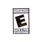 The Your Mom “Rated E” pin by Ballmarkers from Logie Joes features a large black E, “YOUR MOM” above, and “RATE E FOR EVERYONE” below—mimicking a game rating for a funny golf accessory.