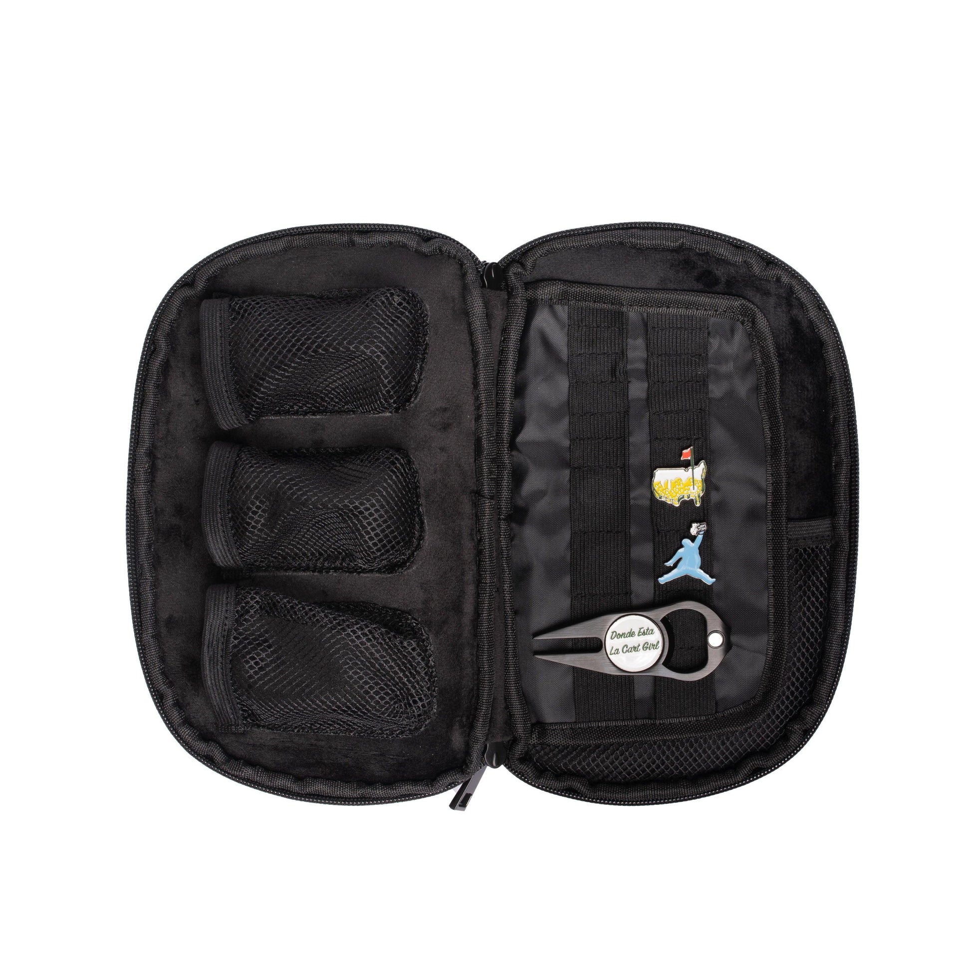 The Grunk Dolfer Grunk Accessory Bag is an open black zippered case with three mesh pockets for golf accessories, assorted pins, and a keychain labeled "Double like a cool chef" attached to the right-side straps.