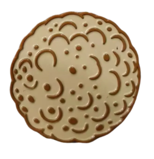 A round beige cookie-like marker with brown edges and raised curves and dots, resembling a cratered moon or Matzo Ball Ball Marker by Golf Gear Heaven, on a white background.