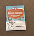 A box labeled The Ultimate Golfers Ballmarkers Advent Calendar by Custom, decorated with snowman and golf-themed winter illustrations, is placed on a brown carpet.