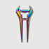 The Guerrilla Golf E Sword Divot Tool is a metallic, rainbow-colored hair stick shaped like a double-pronged pin with a handle, reminiscent of a sleek golf accessory, displayed against a plain white background.
