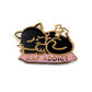 Kolorspun’s Cat Nap Addict Golf Ball Marker features a black cat with closed eyes on a pink cushion labeled NAP ADDICT in gold lettering, accented by Z symbols. This enamel pin is a perfect custom golf gift or unique ball marker.