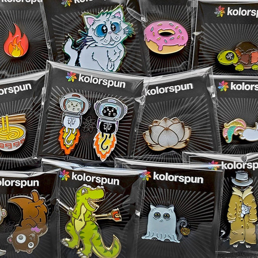 A Vampire Bunny Golf Ball Marker from Kolorspun displayed on a branded card, part of a colorful enamel pin and marker collection featuring playful, custom designs.