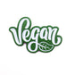 The Kolorspun Vegan Golf Ball Marker is a green and white magnetic marker with "Vegan" in cursive and a leaf design—ideal as a custom golf gift or unique accessory for golfers.
