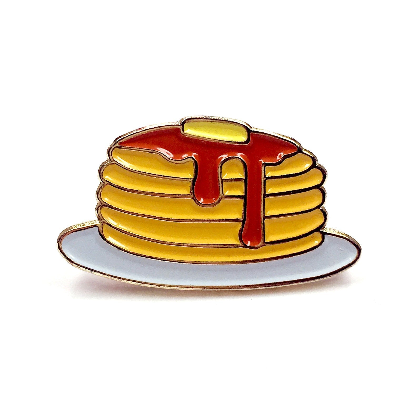 The Kolorspun Pancakes Golf Ball Marker is a cartoon-style enamel pin showing pancakes with butter and syrup on a white plate—a quirky gift or unique golf ball marker for breakfast lovers.