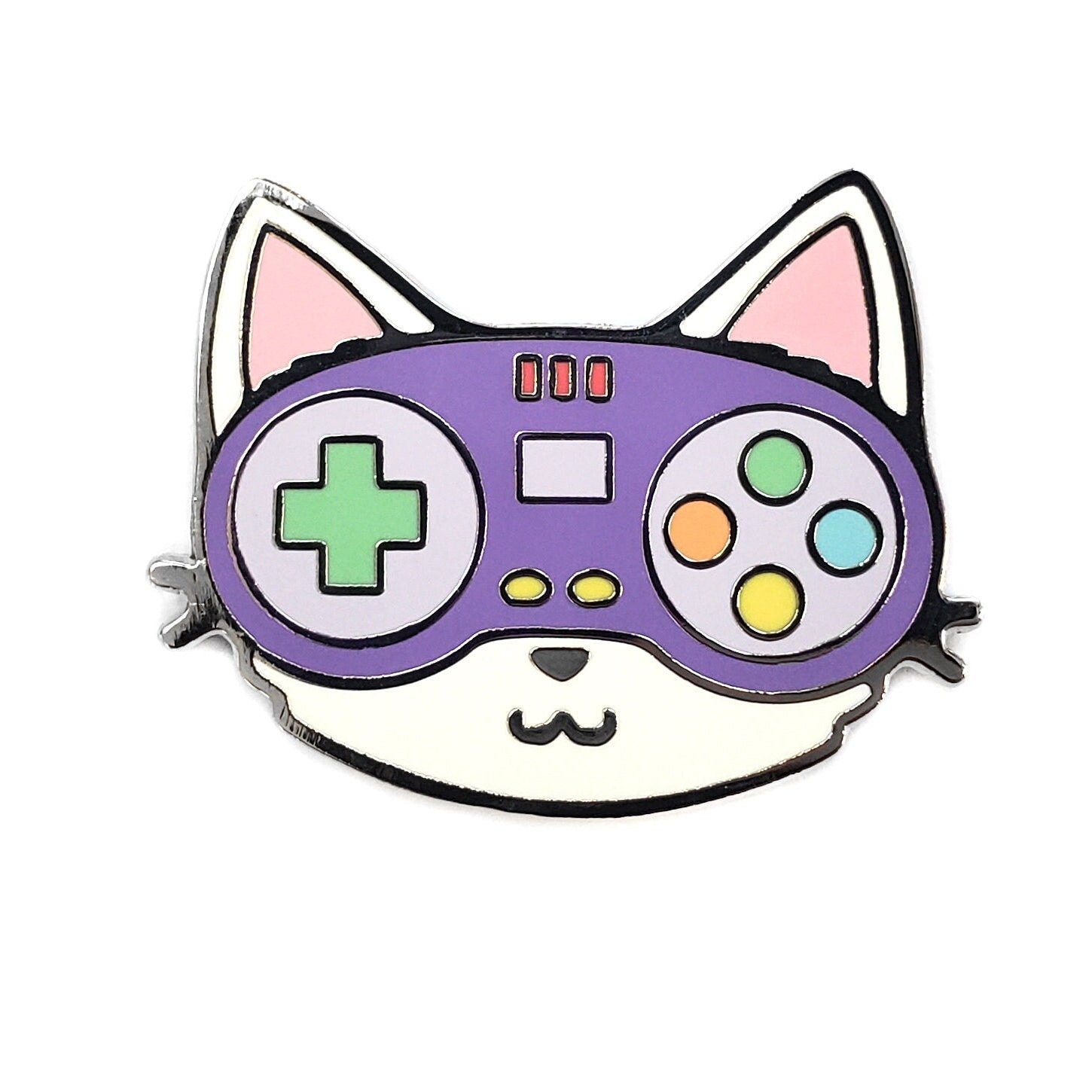 Kolorspun’s Controller Cat Golf Ball Marker features a cartoon cat face with a purple video game controller for eyes and nose, adorned with colorful buttons and a green cross-shaped button, set on a white background.