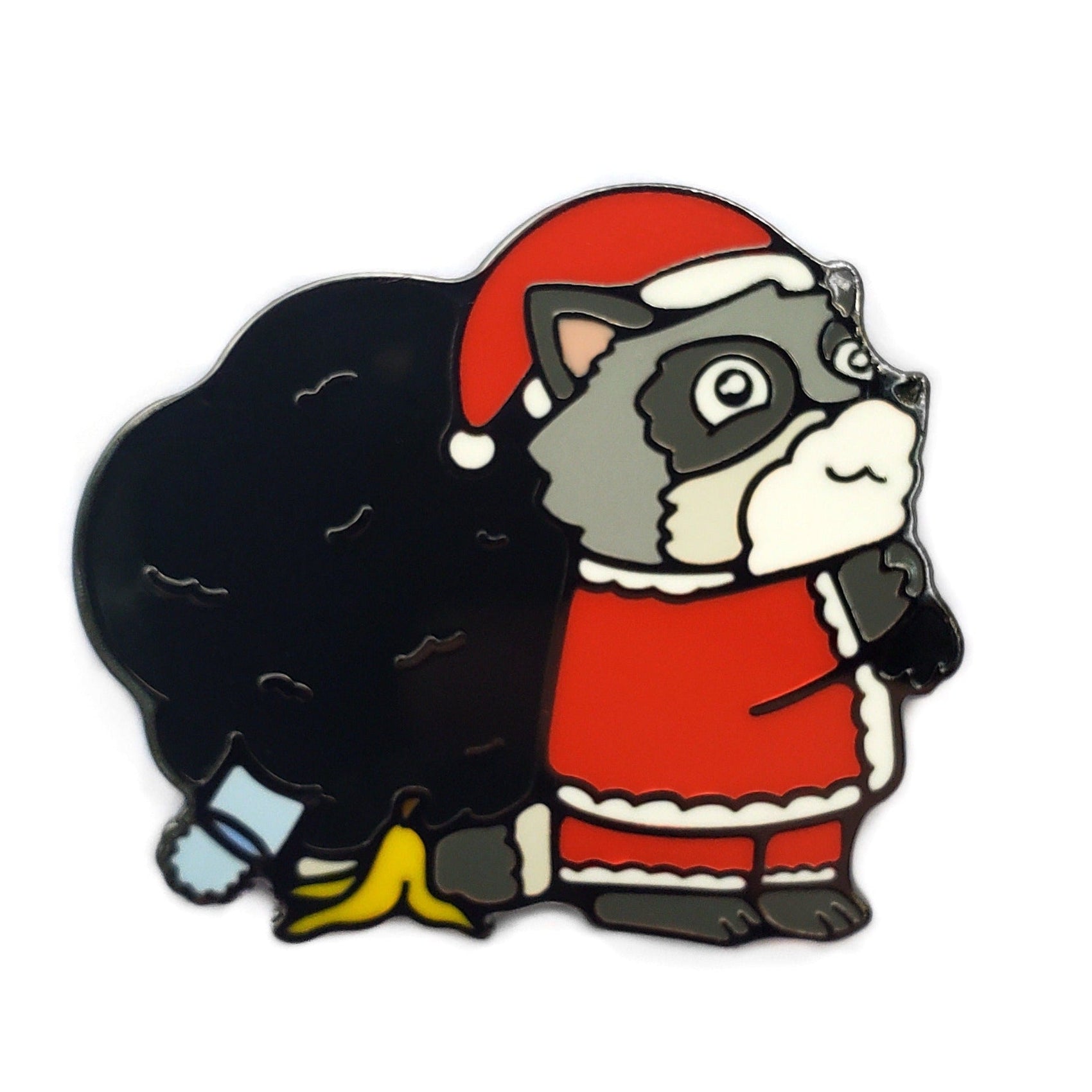 A cartoon raccoon in a Santa suit stands by a toppled Christmas tree with broken ornaments, clutching the Kolorspun Raccoon Santa Golf Ball Marker—his latest golf gift mishap—looking both guilty and surprised.