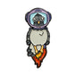 Kolorspun's Astronaut Pigeon Golf Ball Marker features a cartoon pigeon in a purple space helmet blasting off—a fun, unique gift for any golfer.