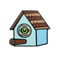Kolorspun’s Bird Watching Birdhouse Golf Ball Marker features a cartoon birdhouse with a brown roof, blue walls, a large rolled-up cigar as the perch, and a custom golf ball marker for the green eye where the entrance hole would be.