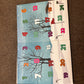 The Ultimate Golfers Ballmarkers Advent Calendar by Custom features colorful, numbered doors from 1 to 21 set against a wintry backdrop with bare trees, snow, and golf-themed elements like clubs and ball markers inspired by Ballmakers.com. The calendar is displayed open on a brown carpet.