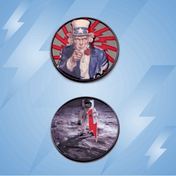 The Byrd, LLC BYRD BALL MARKERS - Merica: Two circular pins—one with Uncle Sam in a blue suit on a red burst, one with an astronaut on the moon and red lightning bolt. Use as golf ball markers or magnetic golf accessories.