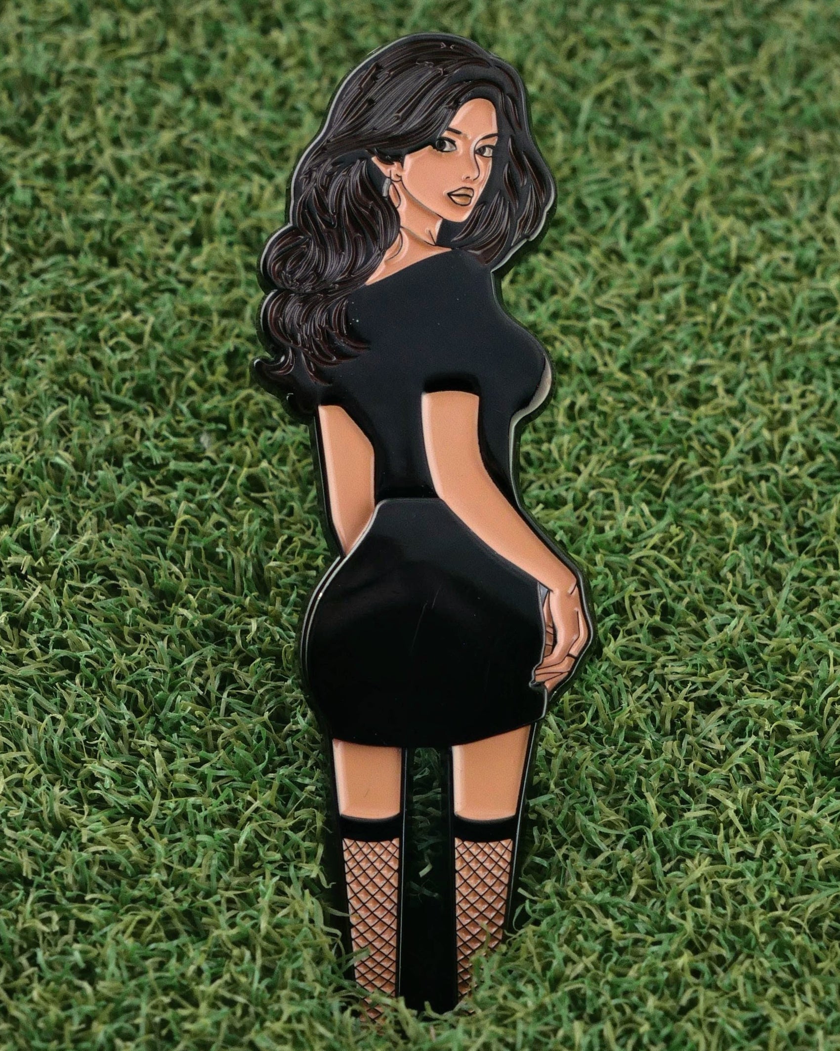 The Thiccc Chick pin by Ballmarkers from Logie Joes features a stylized woman in a black dress and fishnets—making it a unique, eye-catching ball marker for your golf gear collection.
