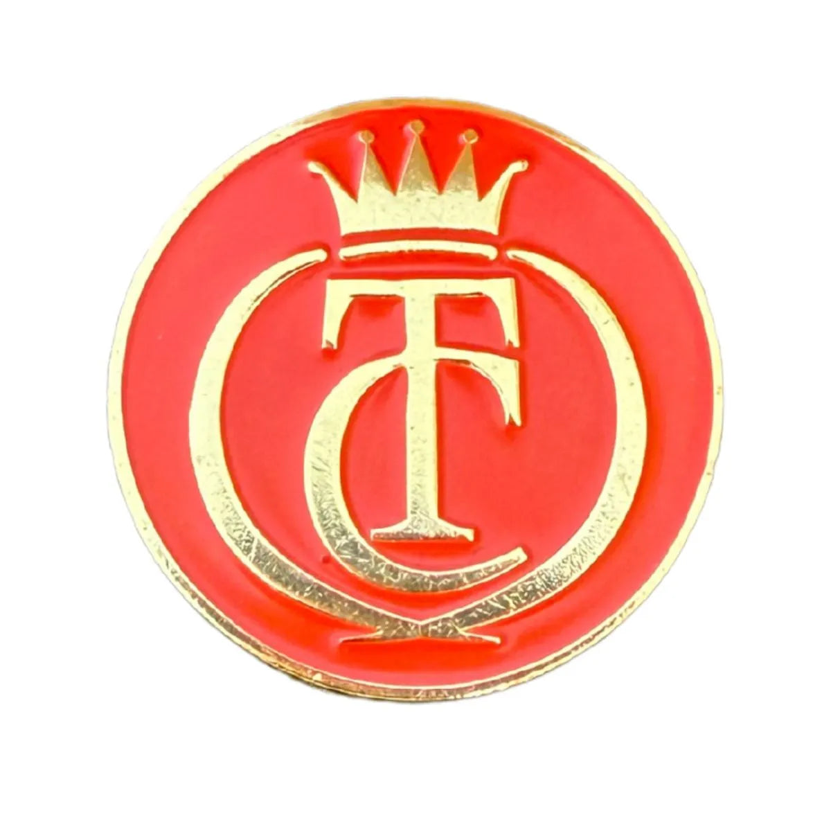 The Grunk Dolfer Tour Champ Ball Marker is a round, gold-trimmed pin with a red background featuring a gold crown over intertwined T and C—ideal as a unique golf ball marker or magnetic hat clip for golf gifts.