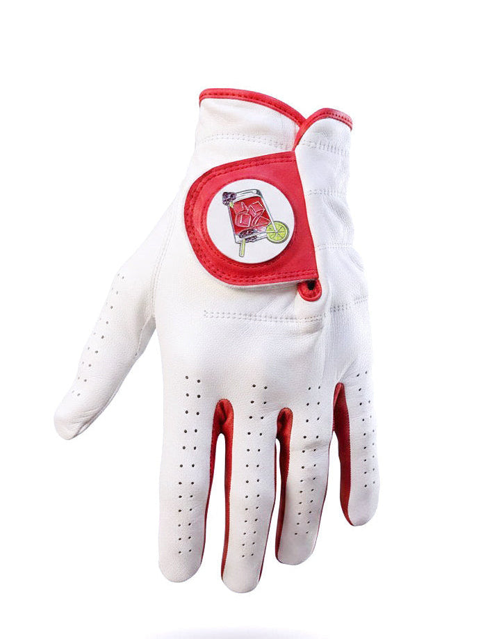 Introducing the Transfusion Cabretta Leather Golf Glove by Logie Joe’s Golf—a premium white golf glove with red trim, crafted from high-quality Cabretta leather. This stylish glove features a round patch on the wrist displaying a vibrant red cocktail with a lemon slice and straw, along with a convenient magnetic ball marker—capturing the fun and lively spirit of Logie Joe’s Golf. Available in both left and right hand, and in standard and cadet sizes.