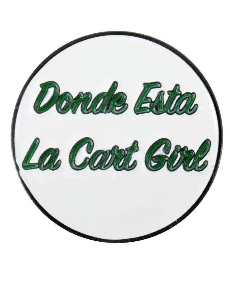 The Grunk Dolfer Donde Esta Ball Marker is a round, white marker with green cursive "Donde Esta La Cart Girl" text outlined in black. It offers a strong magnetic hold, combining secure and stylish use on the course.